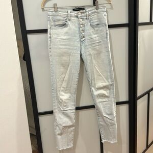 High-rise skinny jeans featuring a light-wash denim finish